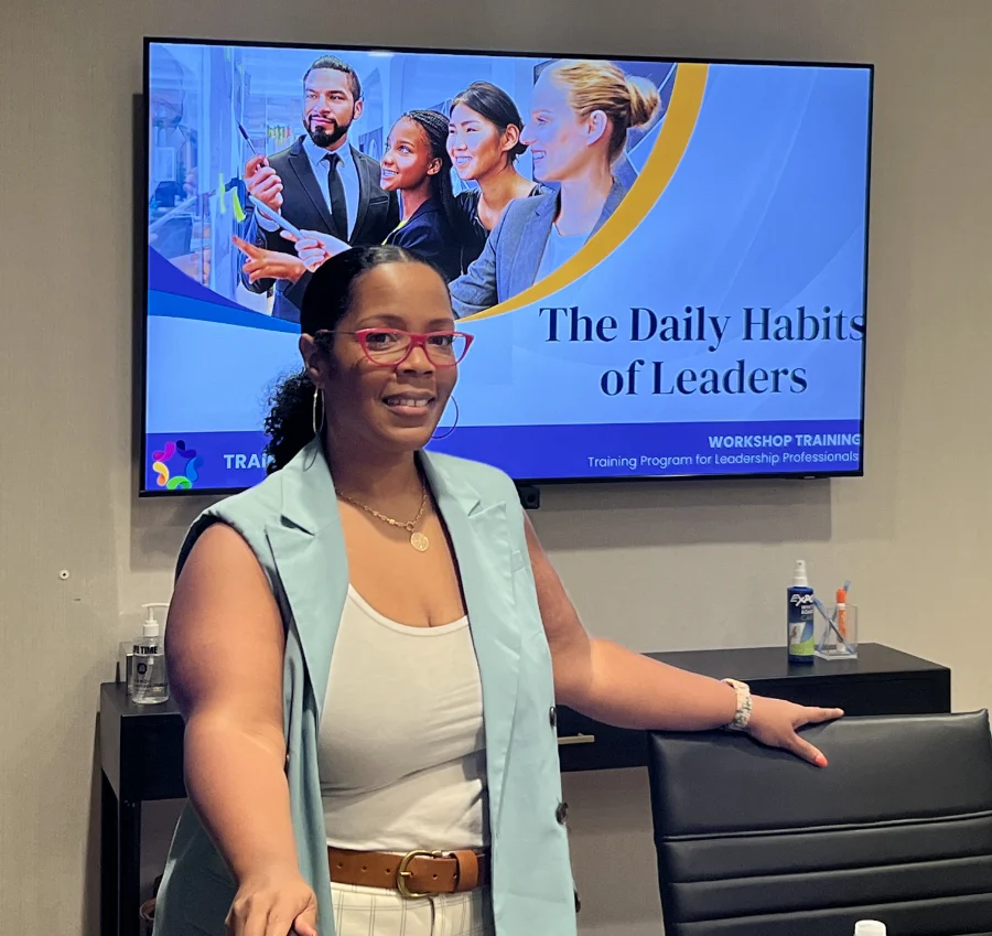 Rae B standing in front of tv